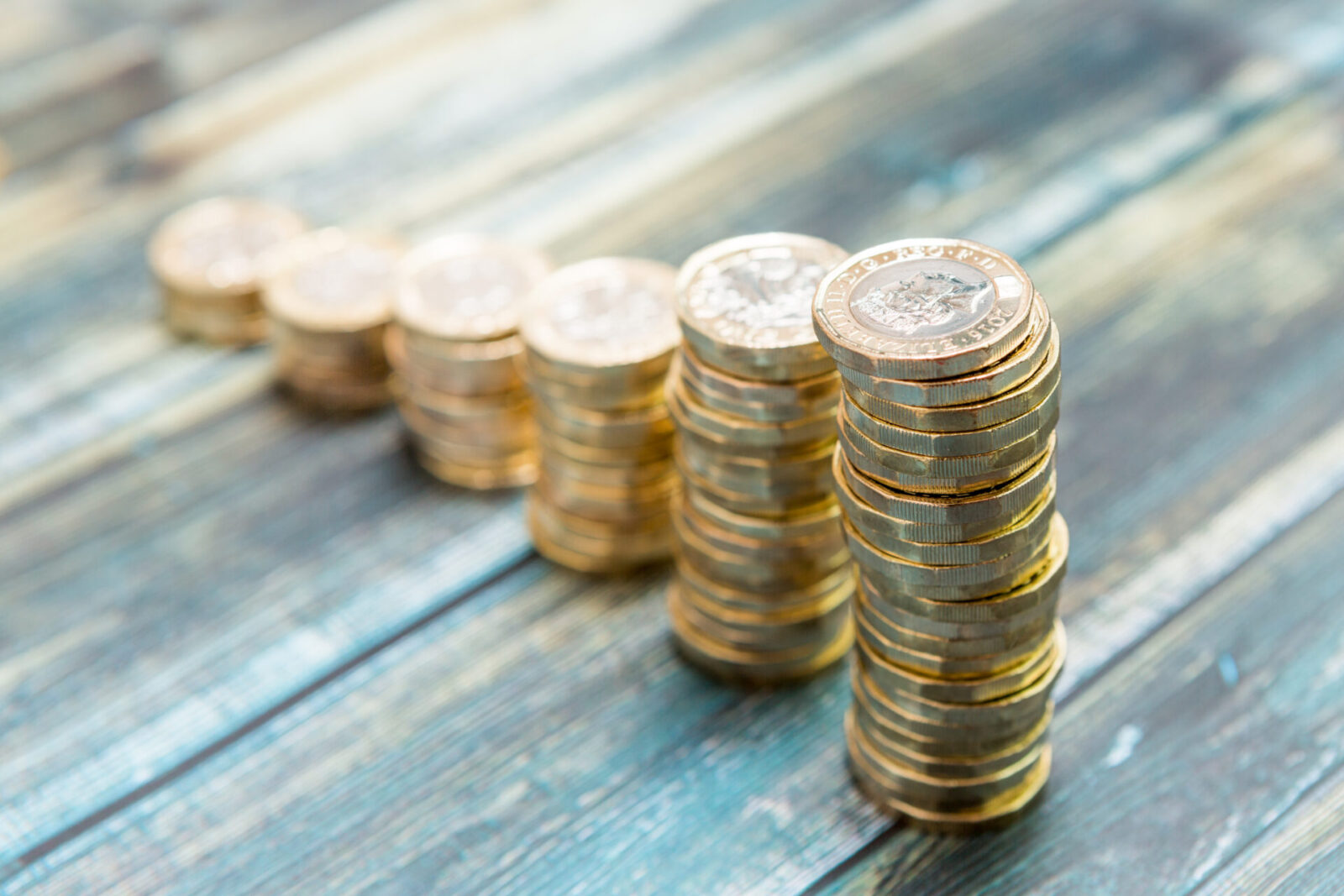 Stacks of coins sit on a table